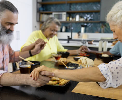 Elderly Adults Enjoying Meal Together at Retirement Home Elderly Adults Enjoying Meal Together at Retirement Home